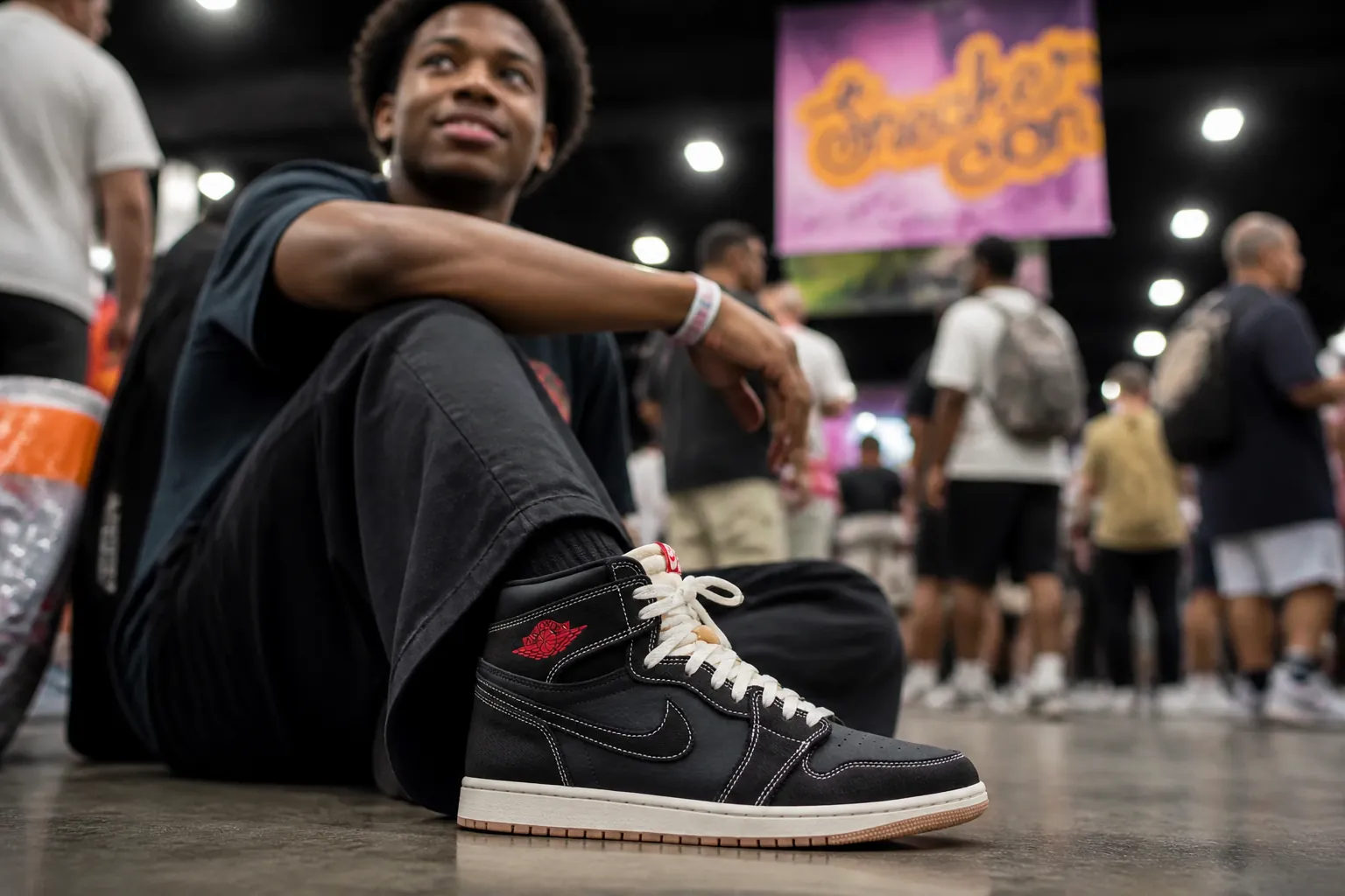 Lifestyle photo of a satisfied customer wearing their Jordan 1s at a sneaker convention