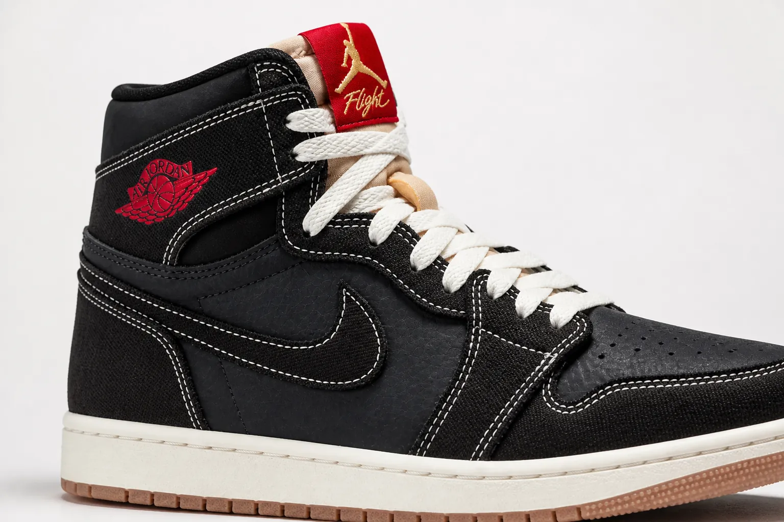 Premium Jumpman embroidery detail on tongue showing gold thread with shadow effect