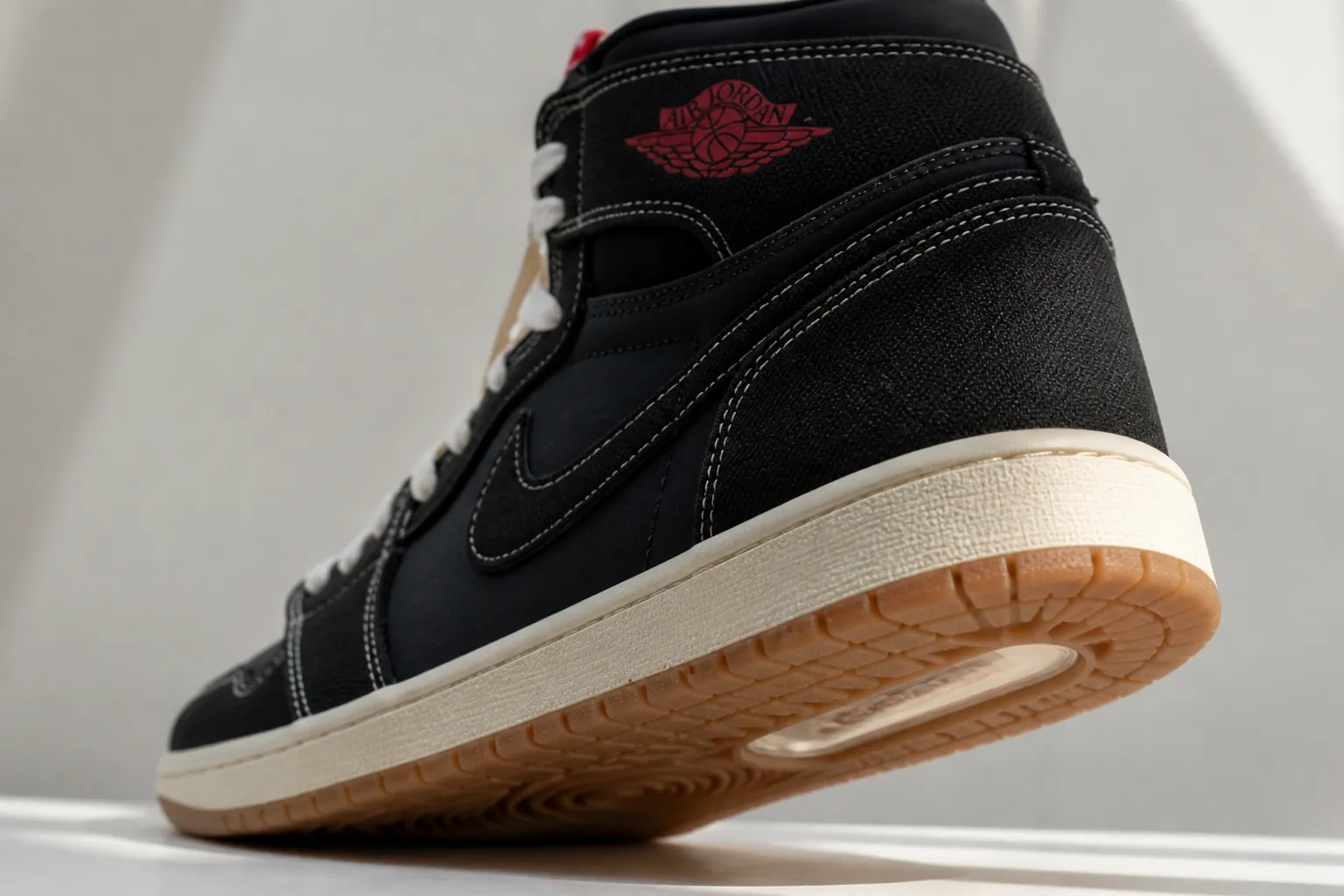 Under heel view of the Air Jordan 1 showing the encapsulated Nike Air-Sole unit visible through the outsole, demonstrating the cushioning technology that provides responsive comfort