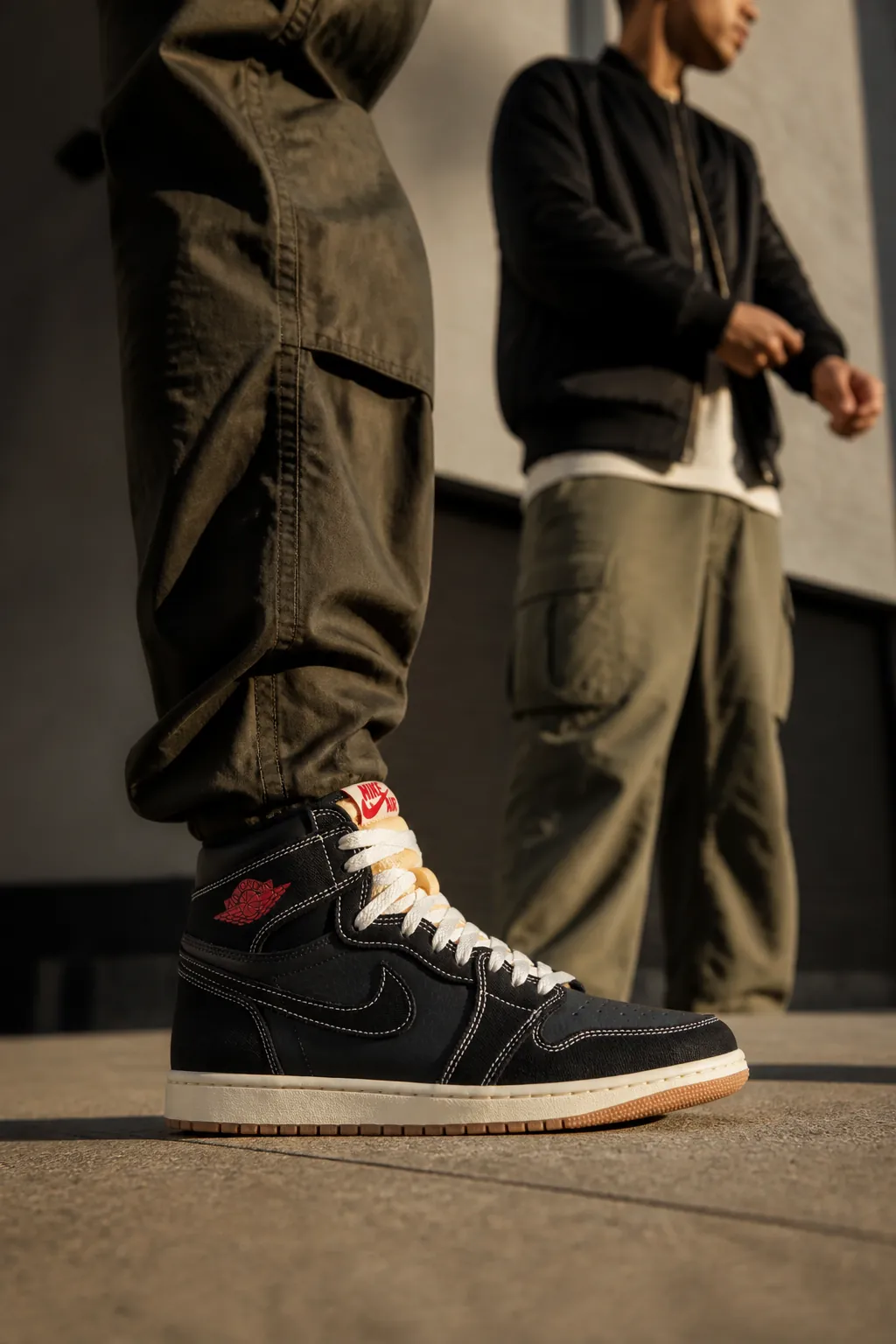 Premium street style: fashion-forward look with Flight Club AJ1, cargo pants, bomber jacket, and accessories
