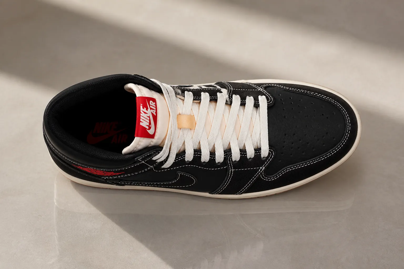 Top-down bird's eye view of the Air Jordan 1 Flight Club showing the premium black woven textile upper, crisp white and University Red accents creating a striking geometric pattern