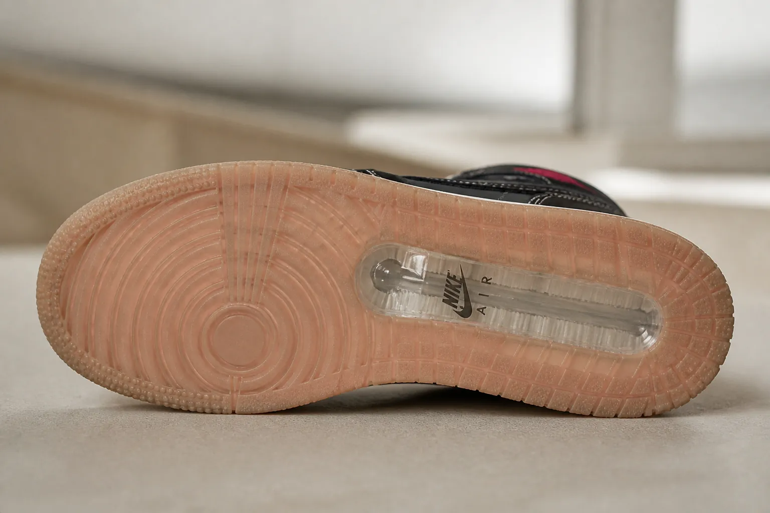 Bottom view of the encapsulated Nike Air-Sole unit in the heel visible through the translucent outsole showing cushioning technology